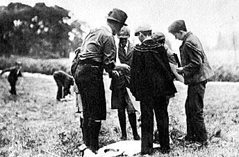 Robert Baden-Powell and the first Scout at the first scout encampment, Brownsea Island, August 1907